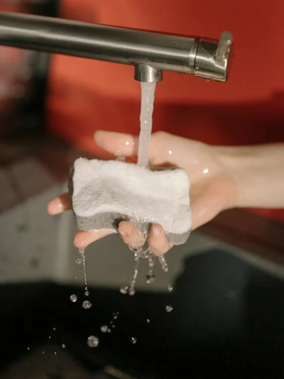 sponge under running water