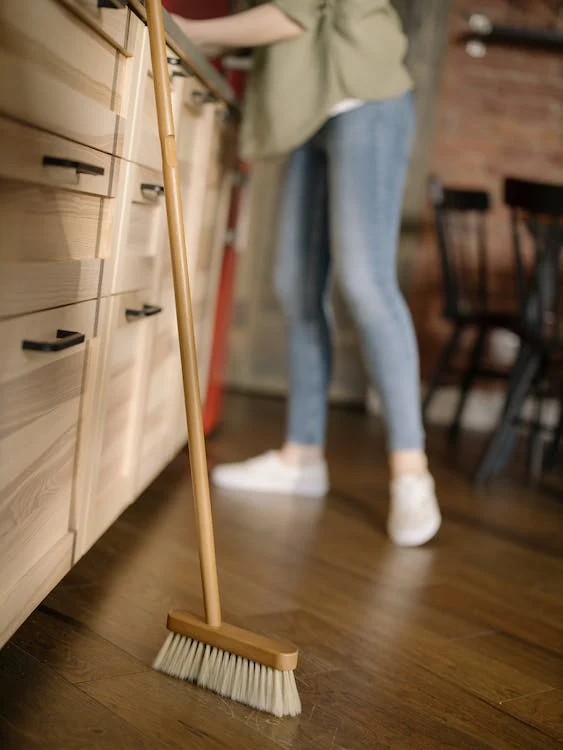 sweeping wood floor